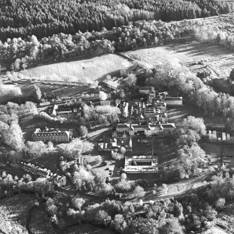 Oblique aerial view centred on the hospital and asylum, taken from the NW.