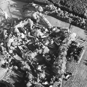 Oblique aerial view centred on the hospital and asylum, taken from the WSW.