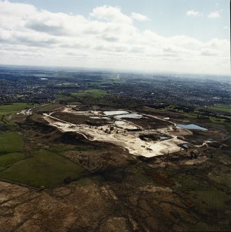 General oblique aerial view looking across the quarry towards Milngavie and Bearsden, taken from the WNW.