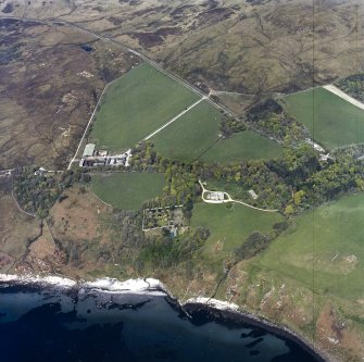 Oblique aerial view centred on the house and walled garden, taken from the SE.