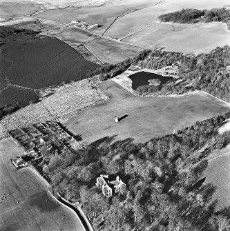 Lawhead House, oblique aerial view, taken from the SE, showing the country house and Lawhead Croft cottage in the bottom left-hand corner, and a dovecot in the centre of the photograph.