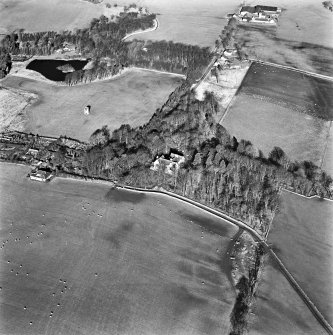 Lawhead House, oblique aerial view, taken from the S, showing the country house in the centre, Lawhead Croft cottage and a dovecot in the left centre, and The Lodge at Lawhead in the top right-hand corner of the photograph.