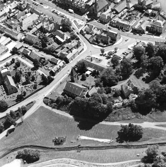 Oblique aerial view of Biggar centred on Moat Park Church, taken from the NW.