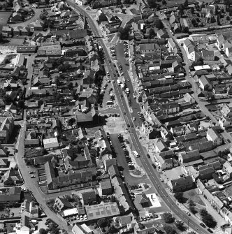 Oblique aerial view of Biggar High Street centred on the Corn Exchange, taken from the ENE.