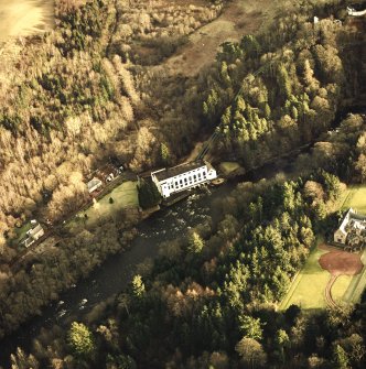 Oblique aerial view centred on Bonnington power station with pavilion adjacent, taken from the WNW.