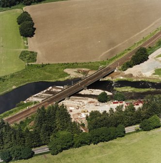 Oblique aerial view centred on the railway bridge, taken from the SSE.