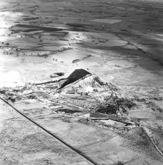 Oblique aerial view centred on the remains of the coal mines, taken from the SW.