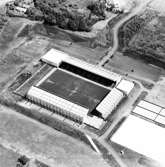 Oblique aerial view centred on the football stadium, taken from the WSW.