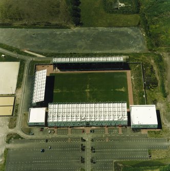 Oblique aerial view centred on the football stadium, taken from the E.