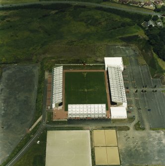 Oblique aerial view centred on the football stadium, taken from the S.