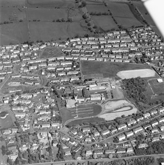 Oblique aerial view of Kilsyth centred in the school, taken from the SSE.