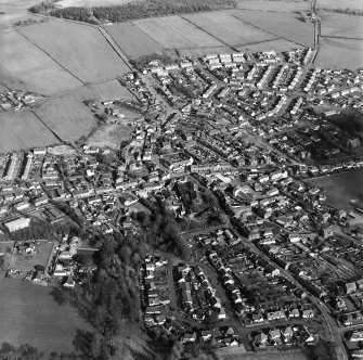 Oblique aerial view of the town centred on the church, taken from the WSW.