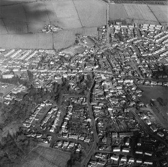 Oblique aerial view of the town centred on the church, taken from the SW.