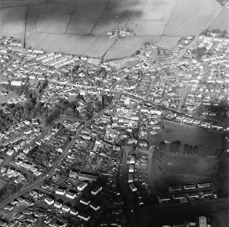 Oblique aerial view of the town centred on the church, taken from the SSW.