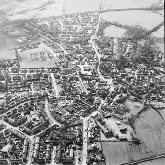 Oblique aerial view of the town centred on the church, taken from the E.