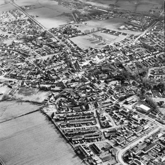 Oblique aerial view of the town centred on the church, taken from the N.