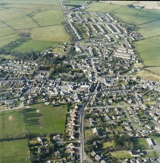 Oblique aerial view of the town centred on the church, taken from the SE.