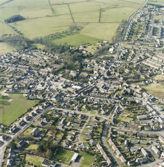 Oblique aerial view of the town centred on the church, taken from the E.