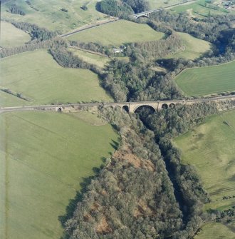 Oblique aerial view centred on the railway viaduct, taken from the WSW.