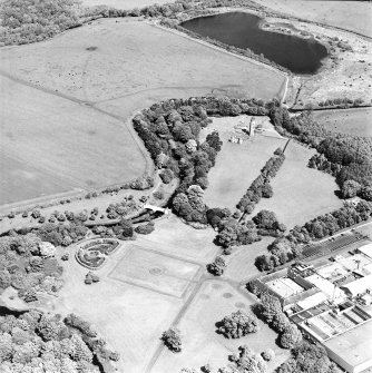 Aerial view of Eglinton Park and bridge, the farmstead and works, and the remains of Eglinton Castle, taken from the WSW.