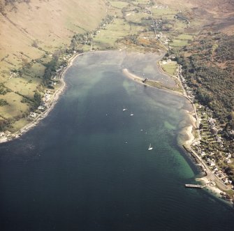 General oblique aerial view centred on Loch Ranza, the village and the remains of the castle, taken from the NW.