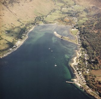 General oblique aerial view centred on Loch Ranza, the village and the remains of the castle, taken from the NW.