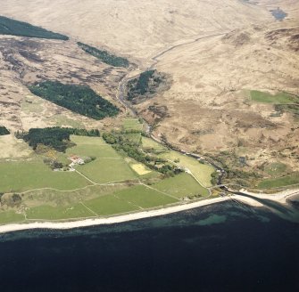 General oblique aerial view looking across the lodge, walled garden, boat house and road bridge along Glen Iorsa, taken from the SW.