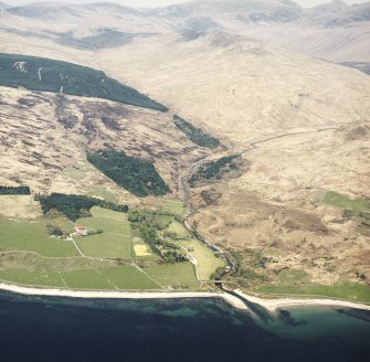 General oblique aerial view looking across the lodge, walled garden, boat house and road bridge towards Glen Scaftigill and Sail Chalmadale, taken from the SW.