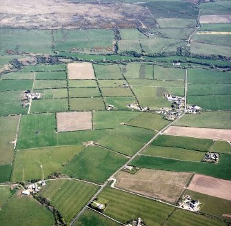 General oblique aerial view centred on the village and farmsteadings, taken from the WNW.