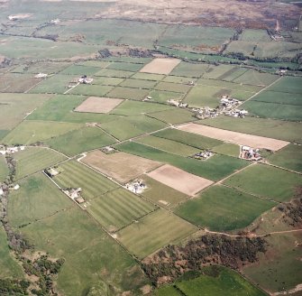 General oblique aerial view centred on the village and farmsteadings, taken from the W.