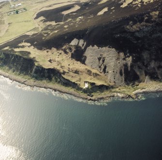 Oblique aerial view of Holy Island centred on the lighthouse with lighthouse adjacent, taken from the E.