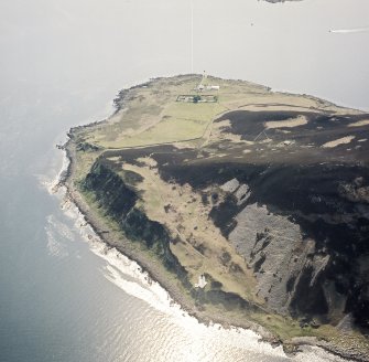 Oblique aerial view of Holy Island centred on the lighthouses, taken from the NE.