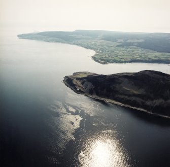 General oblique aerial view looking across Holy Island and the lighthouses towards Kings Cross and Whiting Bay, taken from the NE.