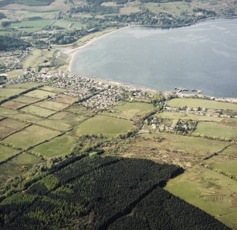 General oblique aerial view looking across the town and pier towards Brodick Bay with the country house beyond, taken from the SE.