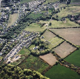 Oblique aerial view of Lamlash centred on the chapel and burial-ground, taken from the NE.