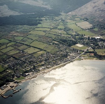 Oblique aerial view centred on the town and pier, taken from the NE.