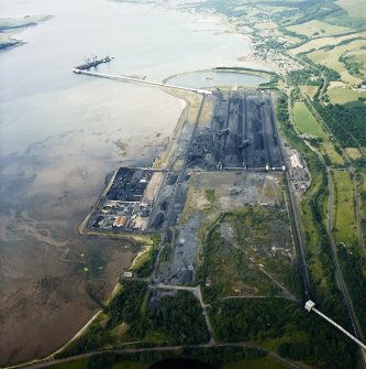 General oblique aerial view looking across the ore terminal towards Fairlie and Largs, taken from the S.
