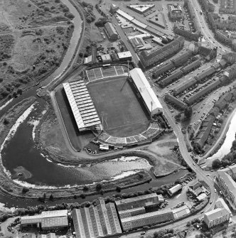 Maryhill, oblique aerial view, centred on Firhill Park and the Forth and Clyde Canal. St Cuthbert's Church is visible in the top right-hand corner of the photograph