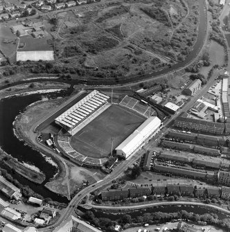 Maryhill, oblique aerial view, centred on Firhill Park and the Forth and Clyde Canal.