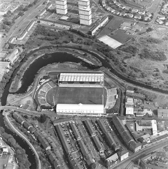 Maryhill, oblique aerial view, centred on Firhill Park and the Forth and Clyde Canal. St Cuthbert's Church is visible in the bottom right-hand corner of the photograph