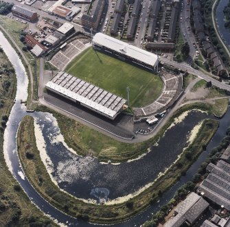 Maryhill, oblique aerial view, centred on Firhill Park and the Forth and Clyde Canal.