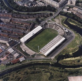 Maryhill, oblique aerial view, centred on Firhill Park and the Forth and Clyde Canal.