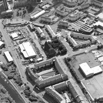 Oblique aerial view centred on Saint Columba's Roman Catholic Church. The Forth and Clyde canal is visible in the bottom left-hand corner of the photograph.