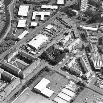 Oblique aerial view centred on Saint Columba's Roman Catholic Church. The Forth and Clyde canal is visible in the top left-hand corner of the photograph.