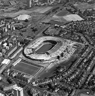 Oblique aerial view of Hampden Park under reconstruction.