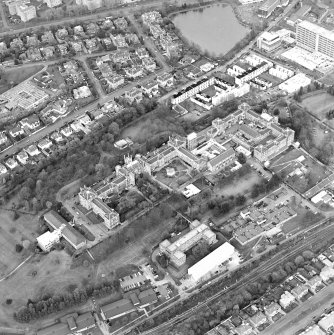 Oblique aerial view centred on the hospital and college workshop, taken from the SW.