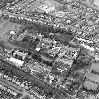 Oblique aerial view centred on the hospital, college and adjoining workshop, taken from the S.
