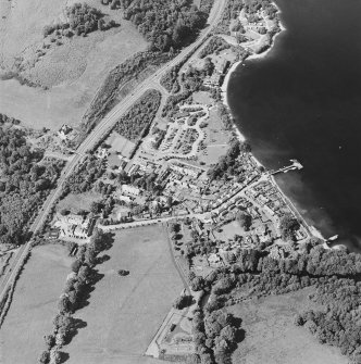 Oblique aerial view centred on the village of Luss, taken from the S.