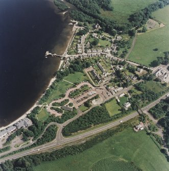 Oblique aerial view centred on the village of Luss, taken from the NW.