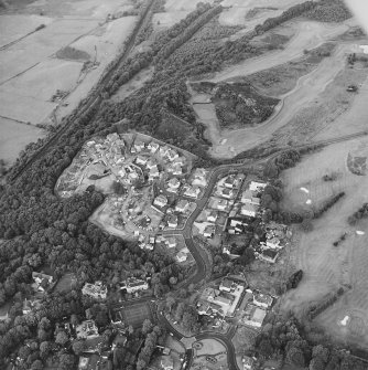 Oblique aerial view centred on the development of the new housing estate (centred on NS 7489 7692), taken from the SW.